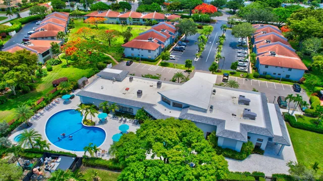 a living room with large lots of furniture and a book shelf