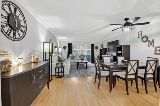 a view of a dining room with furniture window and wooden floor