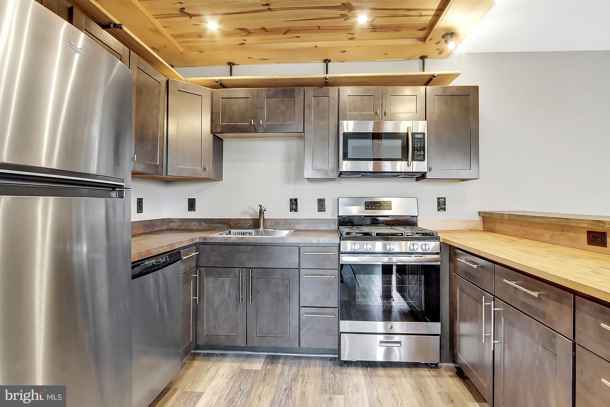 505 Epsom Road, Unit 2D Towson, MD 21286 - Photo 15 of 23 Butcher block, wood ceiling, recessed lites!