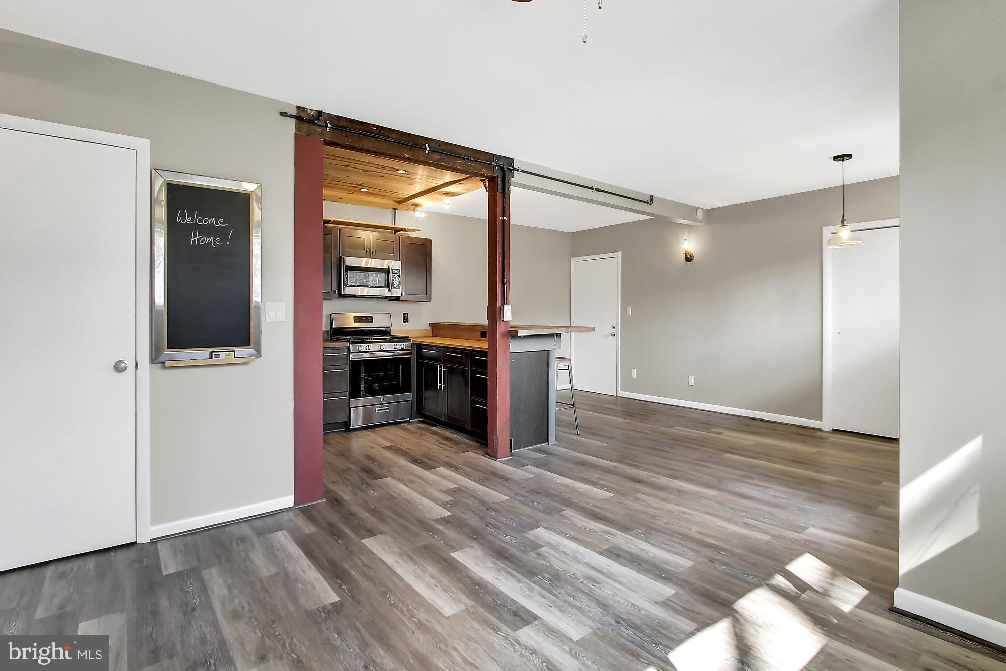 505 Epsom Road, Unit 2D Towson, MD 21286 - Photo 5 of 23 Open concept with all new plank flooring