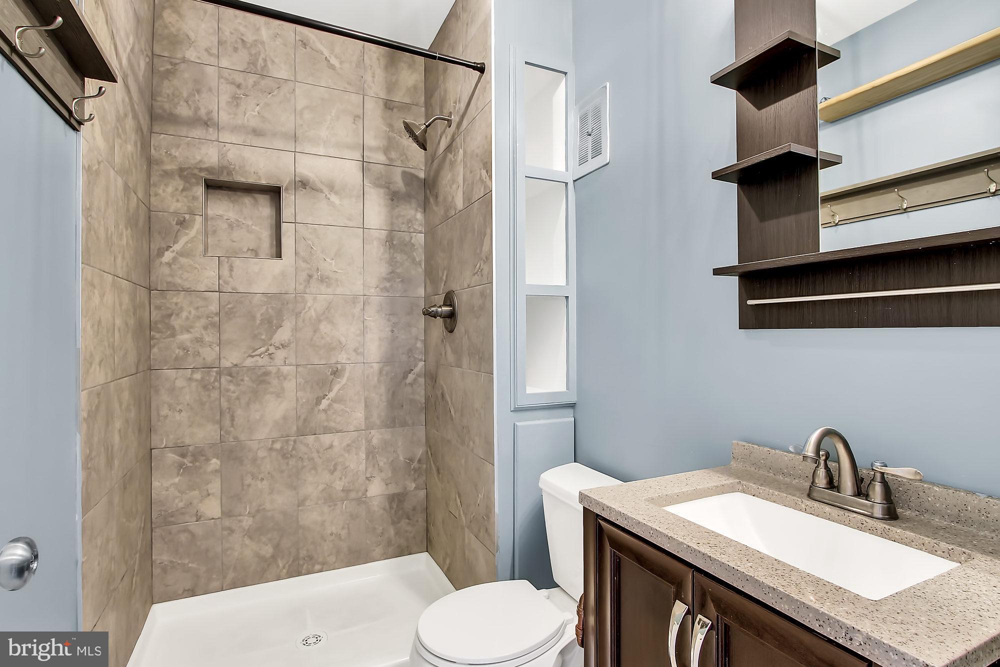 505 Epsom Road, Unit 2D Towson, MD 21286 - Photo 8 of 23 Updated bath with tile oversized shower.