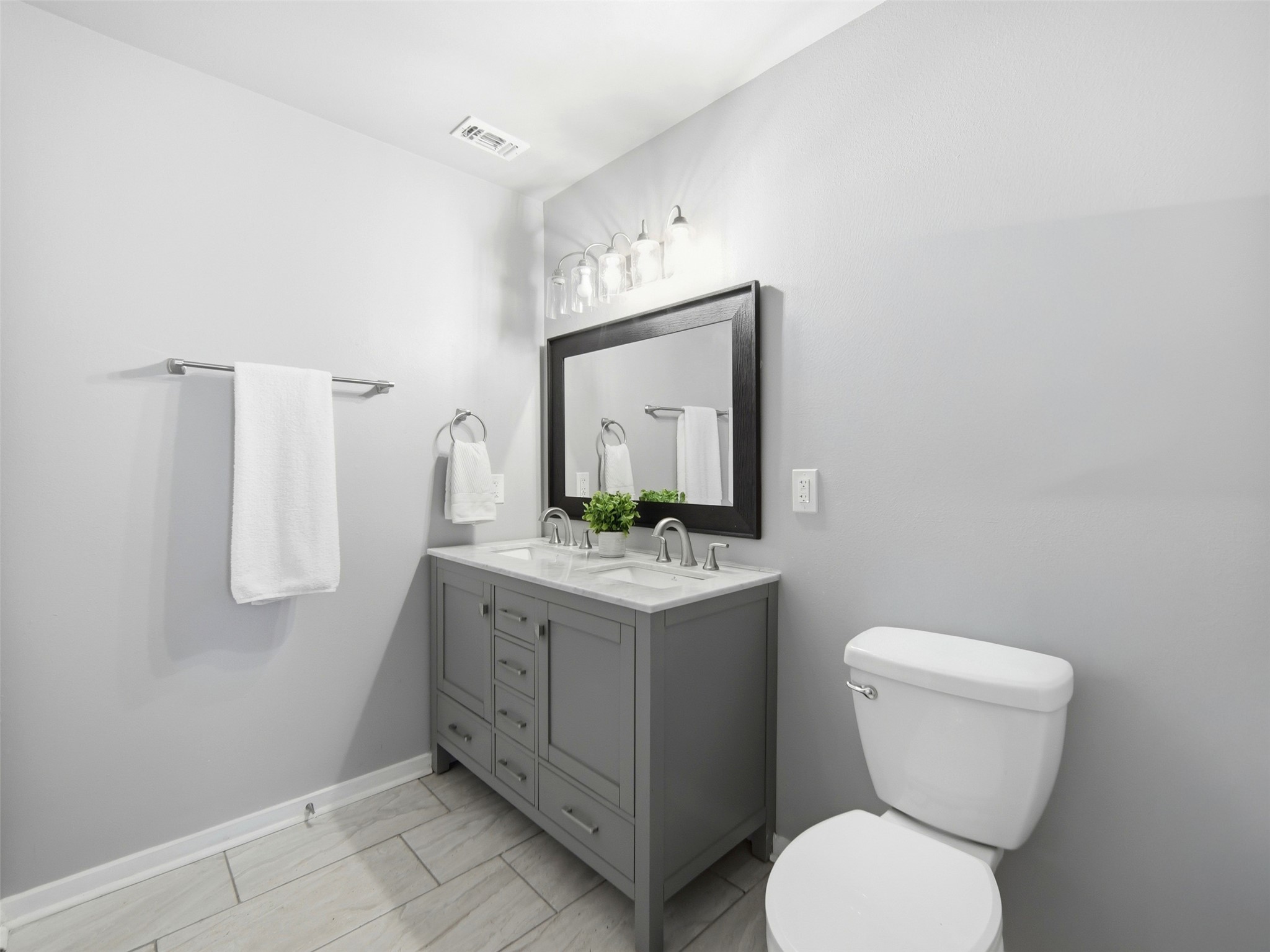 700 9th Street Blanco, TX 78606 - Photo 16 of 33 a bathroom with a toilet sink and mirror