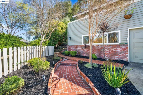a spacious bedroom with a bed and a window