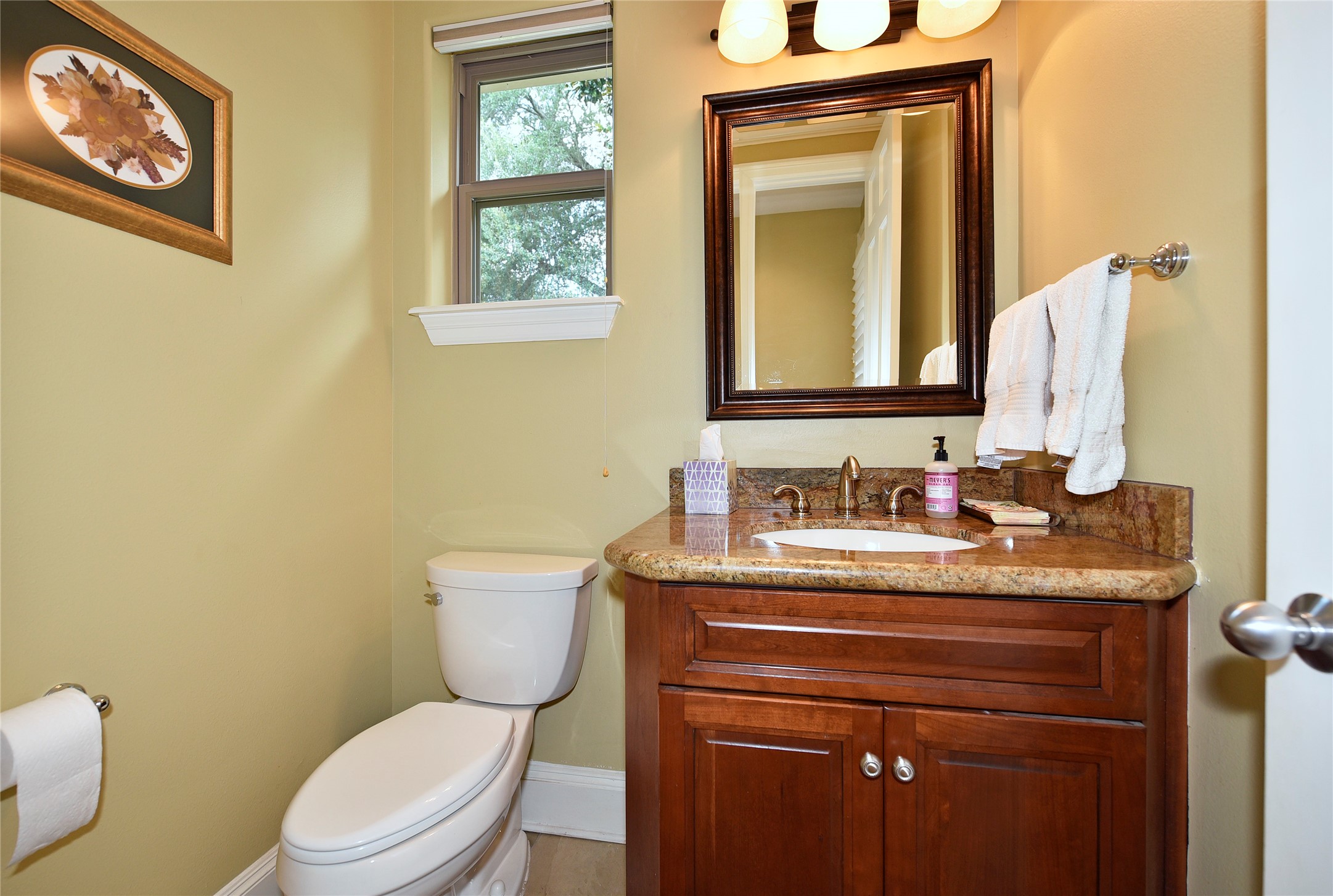 3315 Meadowside Drive Sugar Land, TX 77478 - Photo 17 of 48 a bathroom with a granite countertop toilet sink and mirror