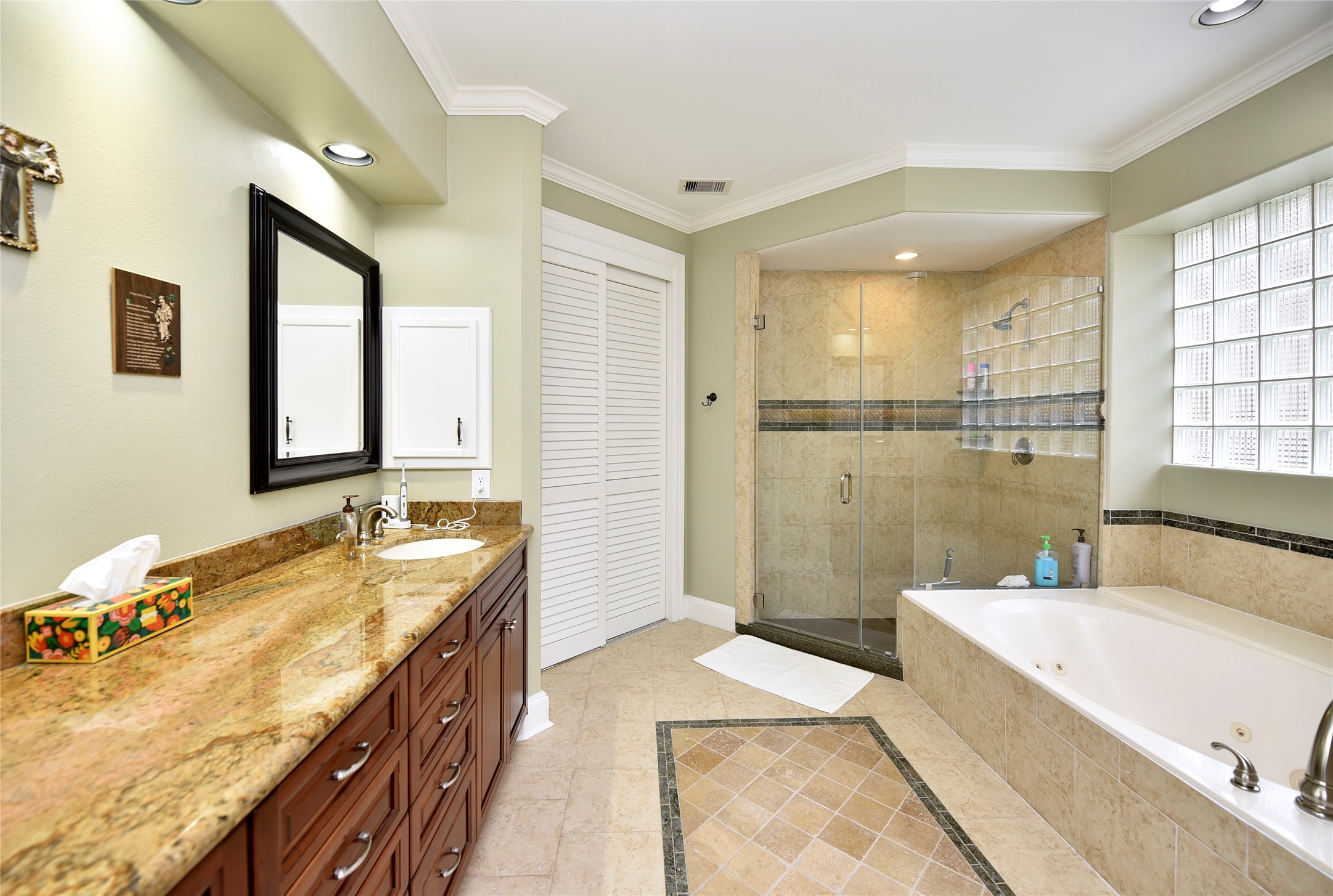 3315 Meadowside Drive Sugar Land, TX 77478 - Photo 21 of 48 a spacious bathroom with a tub sink and mirror