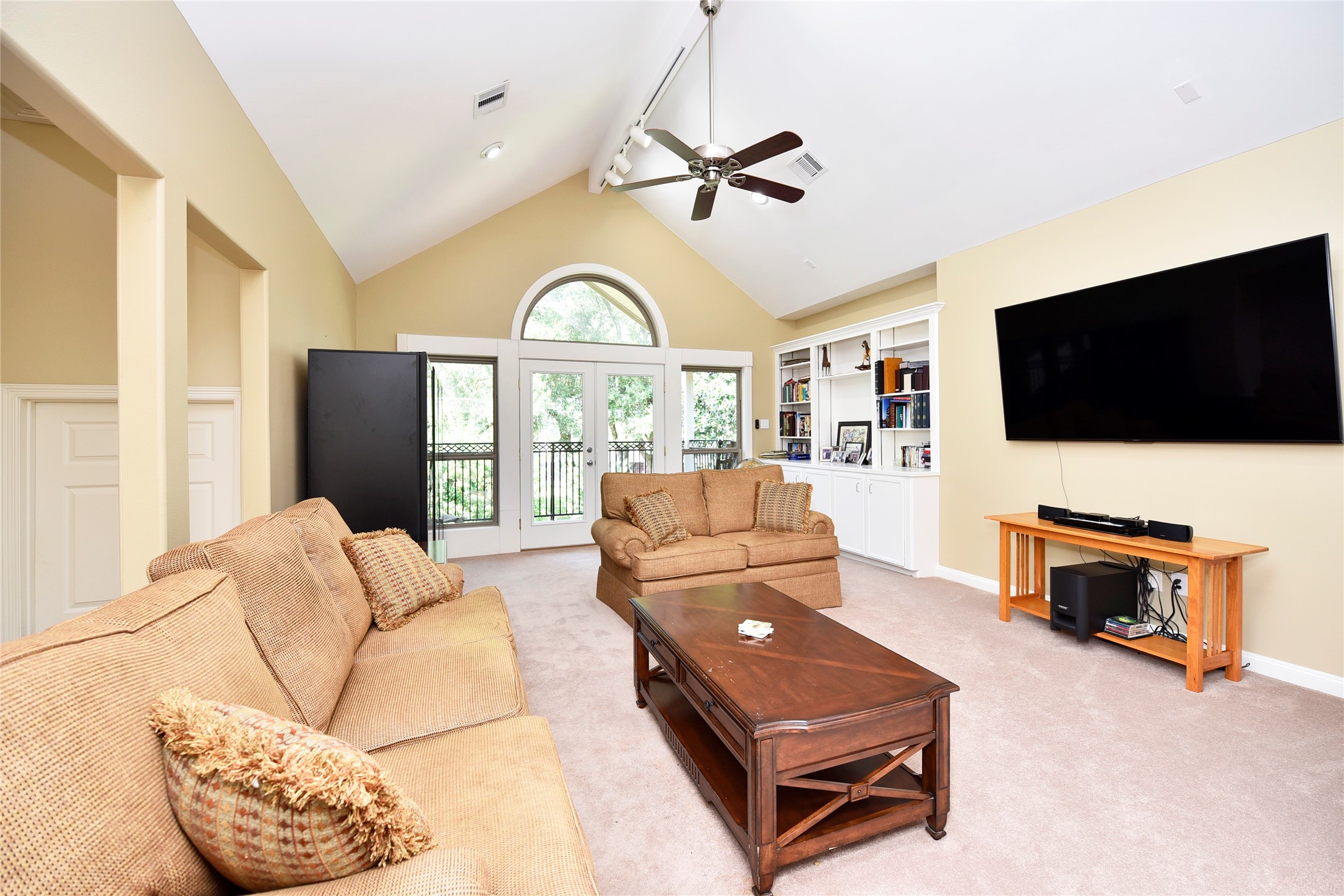 3315 Meadowside Drive Sugar Land, TX 77478 - Photo 25 of 48 a living room with furniture and a flat screen tv