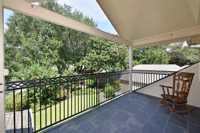 a view of a balcony with chair