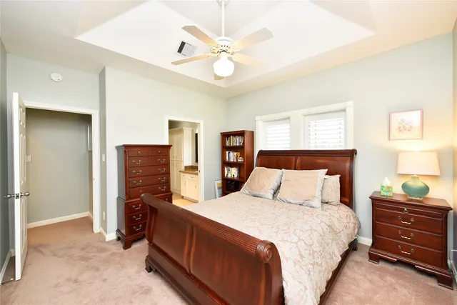 a bedroom with a large bed and a large window