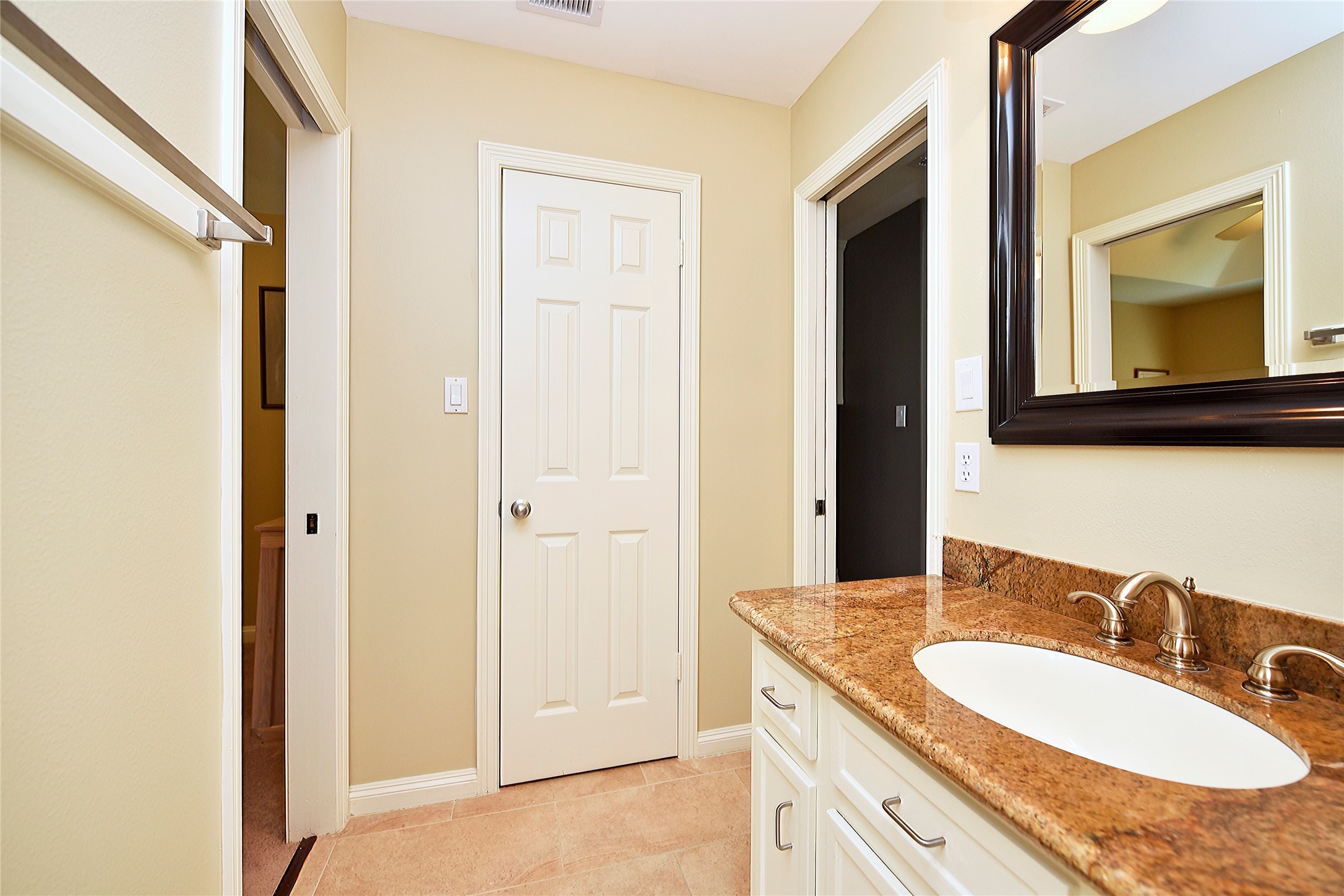 3315 Meadowside Drive Sugar Land, TX 77478 - Photo 34 of 48 a bathroom with a granite countertop sink a mirror and a vanity