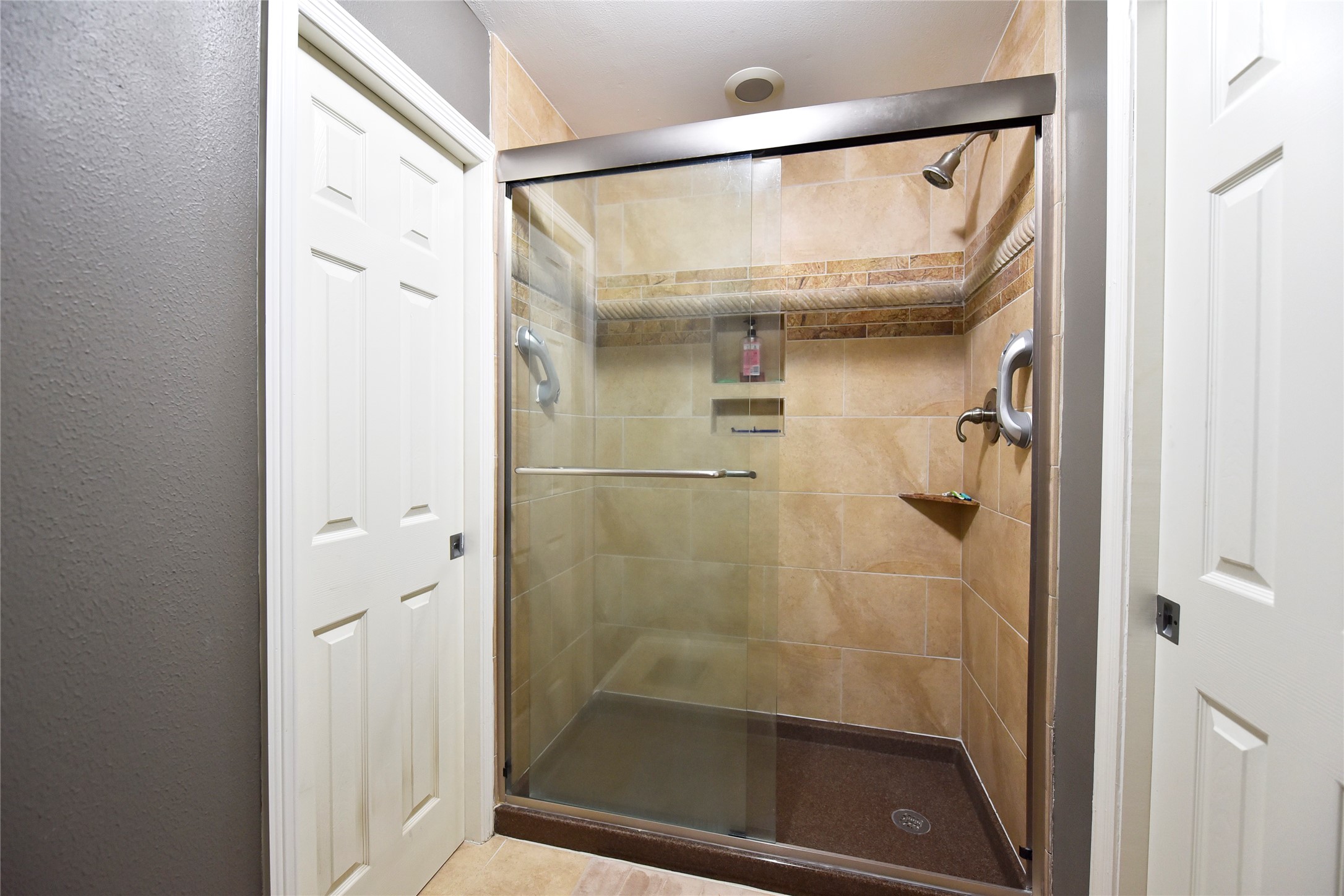 3315 Meadowside Drive Sugar Land, TX 77478 - Photo 35 of 48 a bathroom with a glass shower door