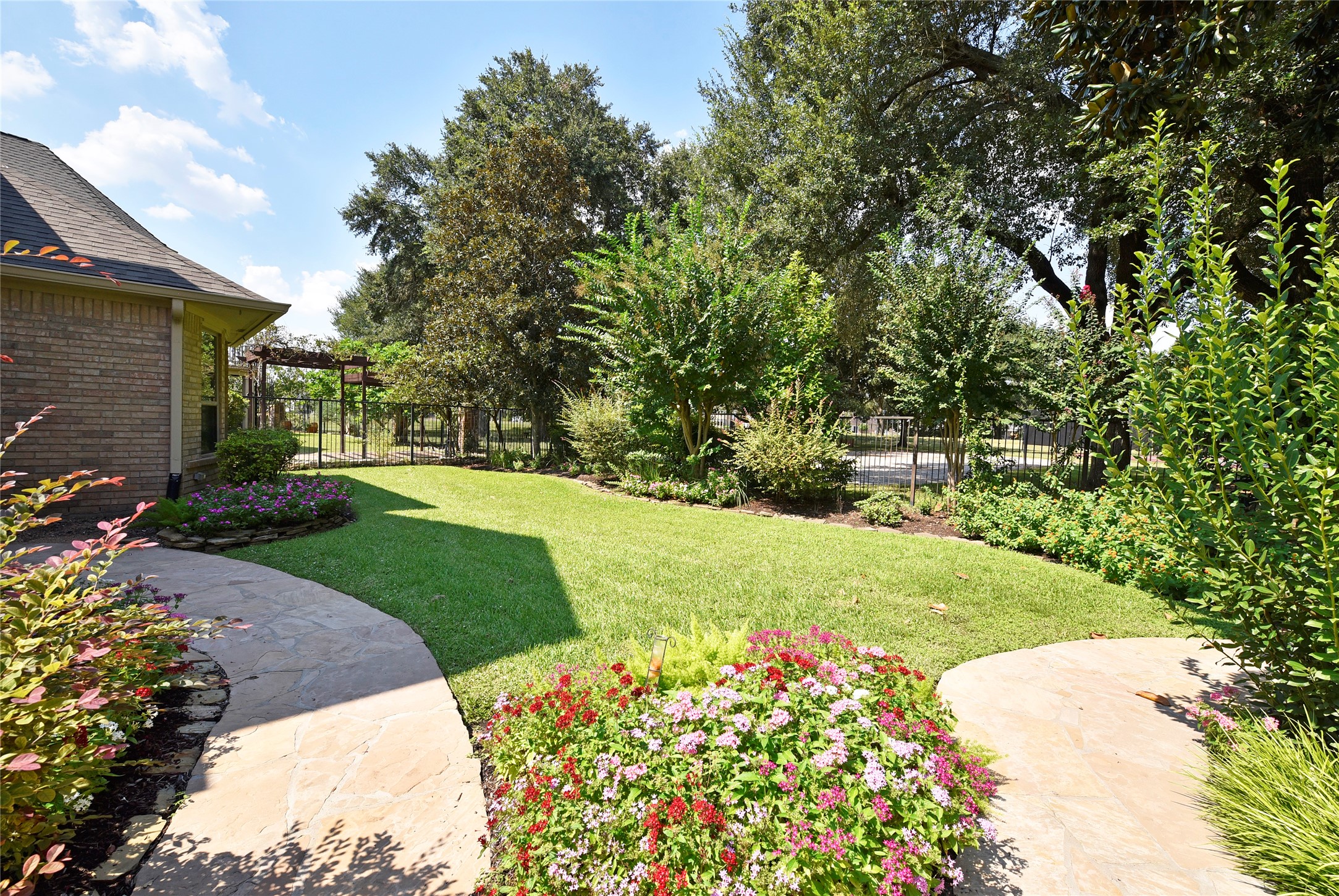 3315 Meadowside Drive Sugar Land, TX 77478 - Photo 39 of 48 a view of a garden with plants and large trees