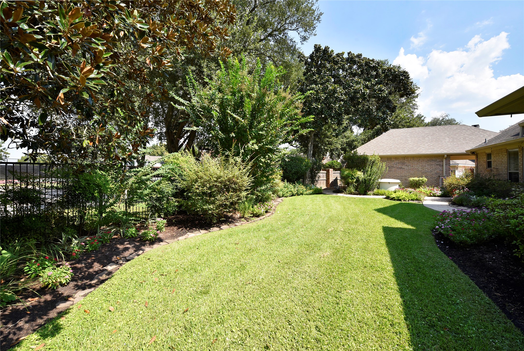 3315 Meadowside Drive Sugar Land, TX 77478 - Photo 40 of 48 a view of a swimming pool with lawn chairs under an umbrella