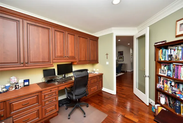 a view of workspace with furniture and book shelf
