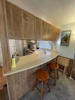 a dining room with furniture and chandelier