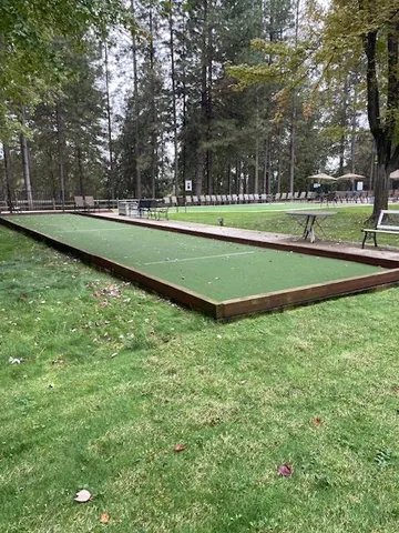 a outdoor space with lots of furniture and a chandelier