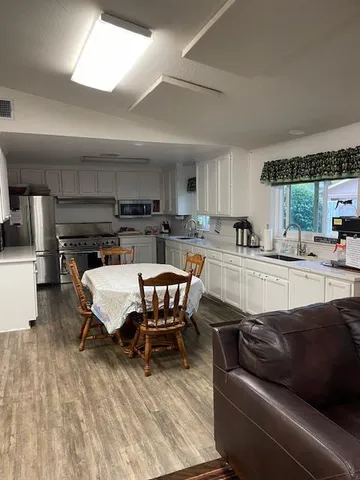 a room with pool table and flat screen tv