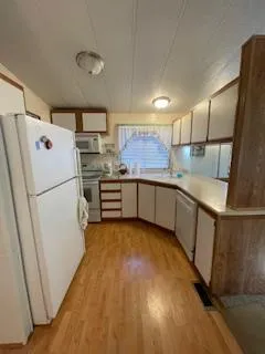 a kitchen with stainless steel appliances a refrigerator and a sink