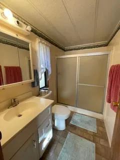 a bathroom with a sink and toilet