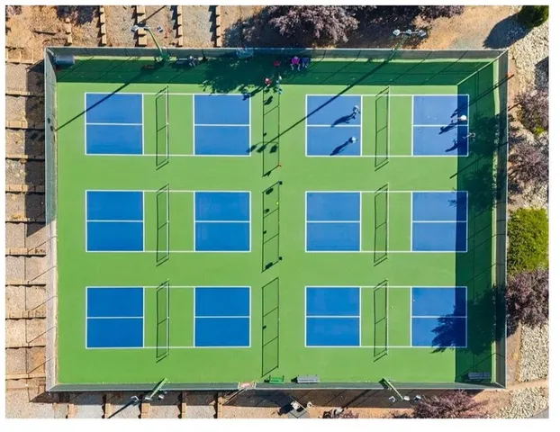 a view of swimming pool with a yard and lake view