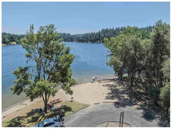 a view of a lake with a yard