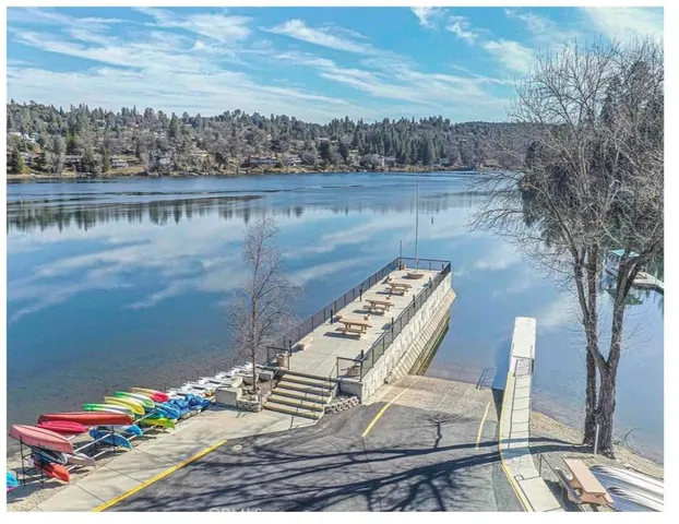 a view of a backyard with swimming pool