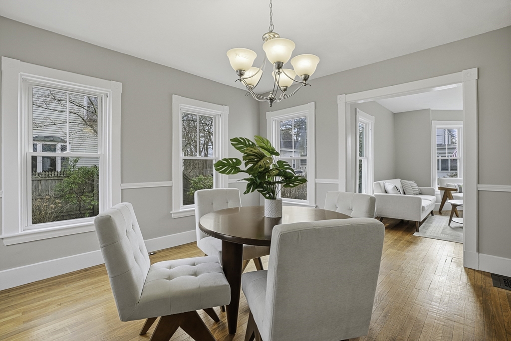 2 Maple Avenue Natick, MA 01760 - Photo 12 of 41 a dining room with furniture potted plants and wooden floor