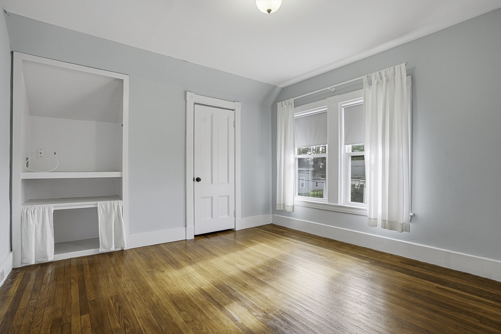 2 Maple Avenue Natick, MA 01760 - Photo 20 of 41 a view of an empty room with wooden floor and a window
