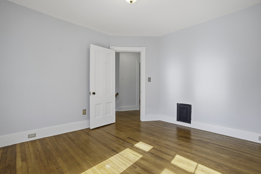 2 Maple Avenue Natick, MA 01760 - Photo 22 of 41 a view of an empty room with wooden floor