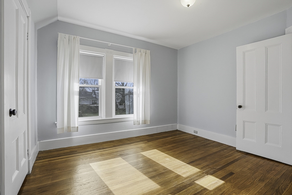 2 Maple Avenue Natick, MA 01760 - Photo 23 of 41 a view of an empty room with wooden floor and a window