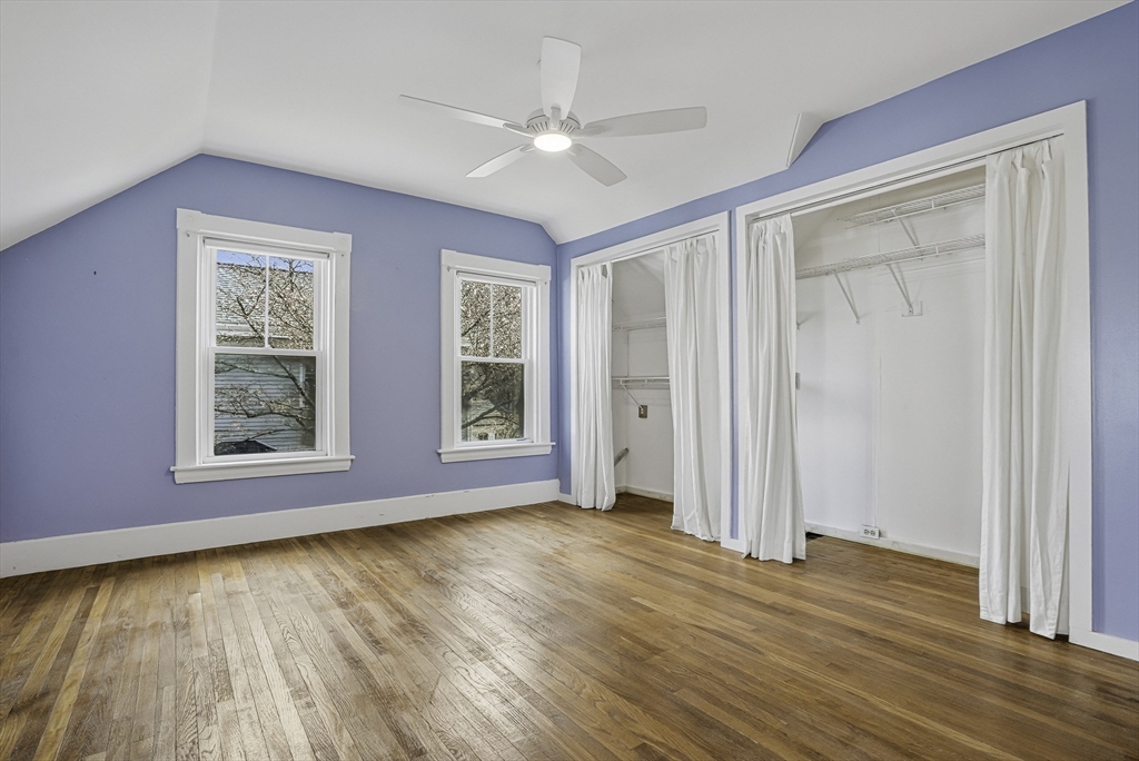 2 Maple Avenue Natick, MA 01760 - Photo 28 of 41 an empty room with wooden floor ceiling fan and windows