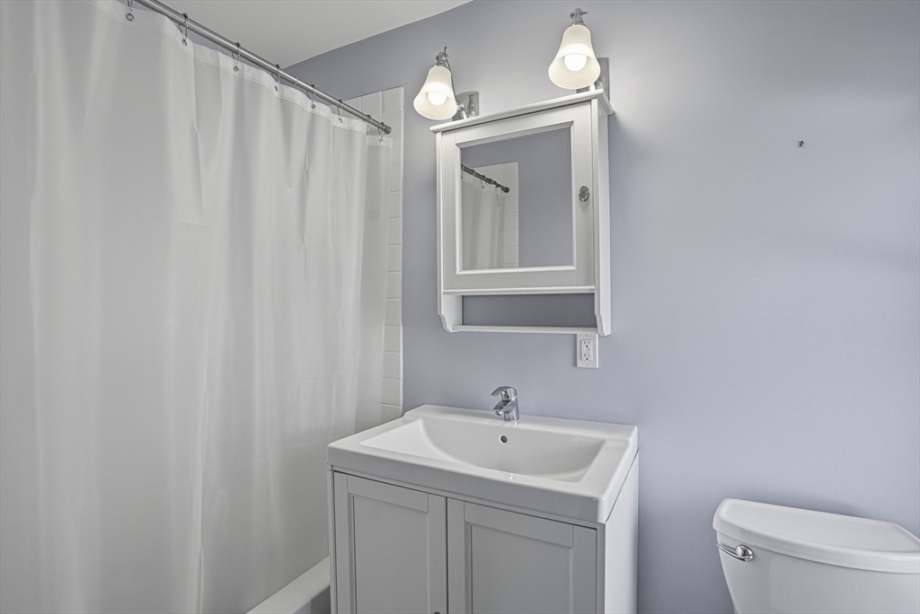 2 Maple Avenue Natick, MA 01760 - Photo 29 of 41 a bathroom with a sink a toilet and a mirror