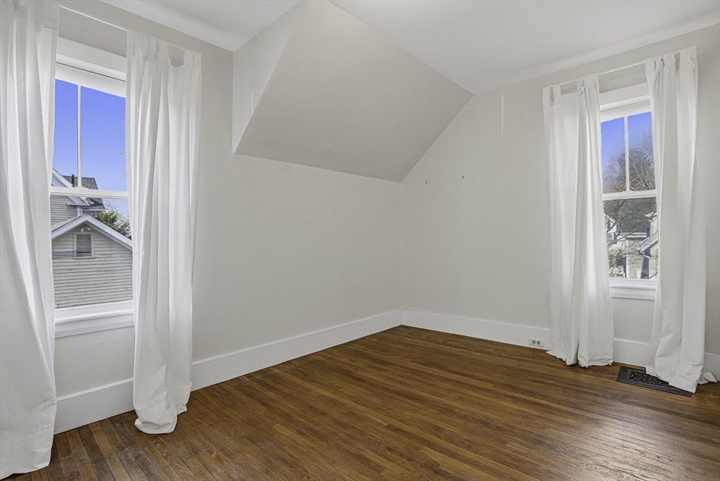 2 Maple Avenue Natick, MA 01760 - Photo 30 of 41 a view of an empty room with wooden floor and a window