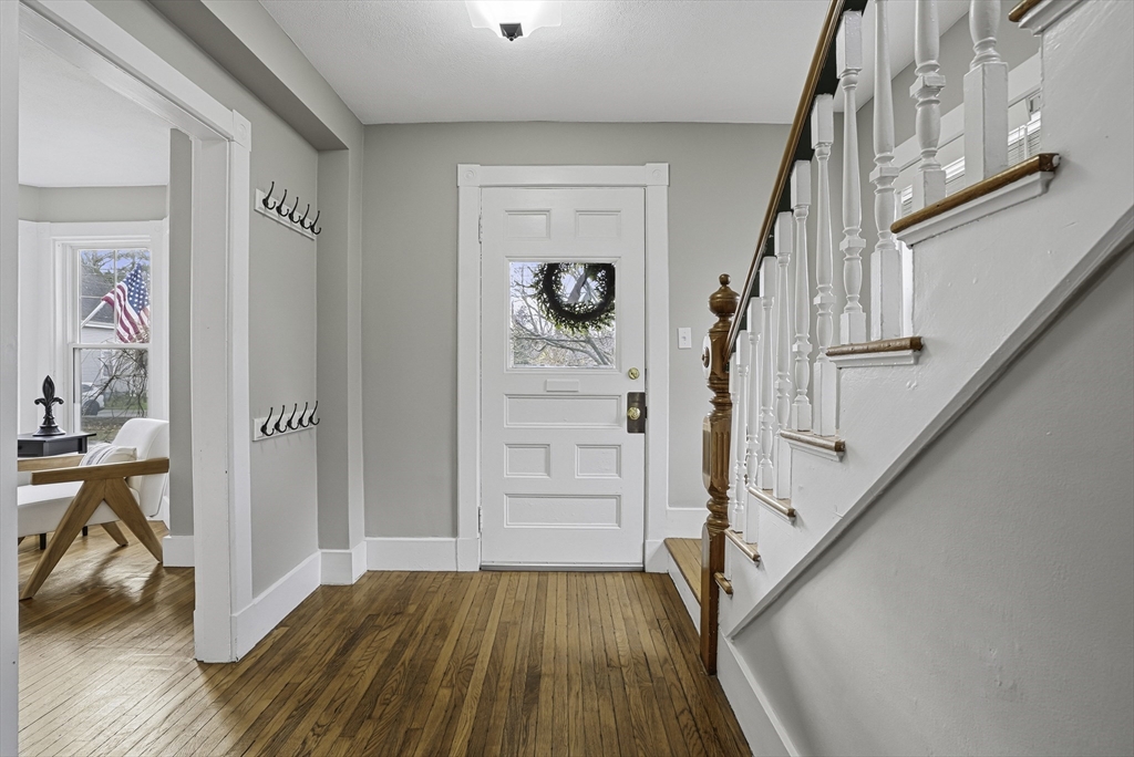 2 Maple Avenue Natick, MA 01760 - Photo 4 of 41 a view of front door with wooden floor and stairs