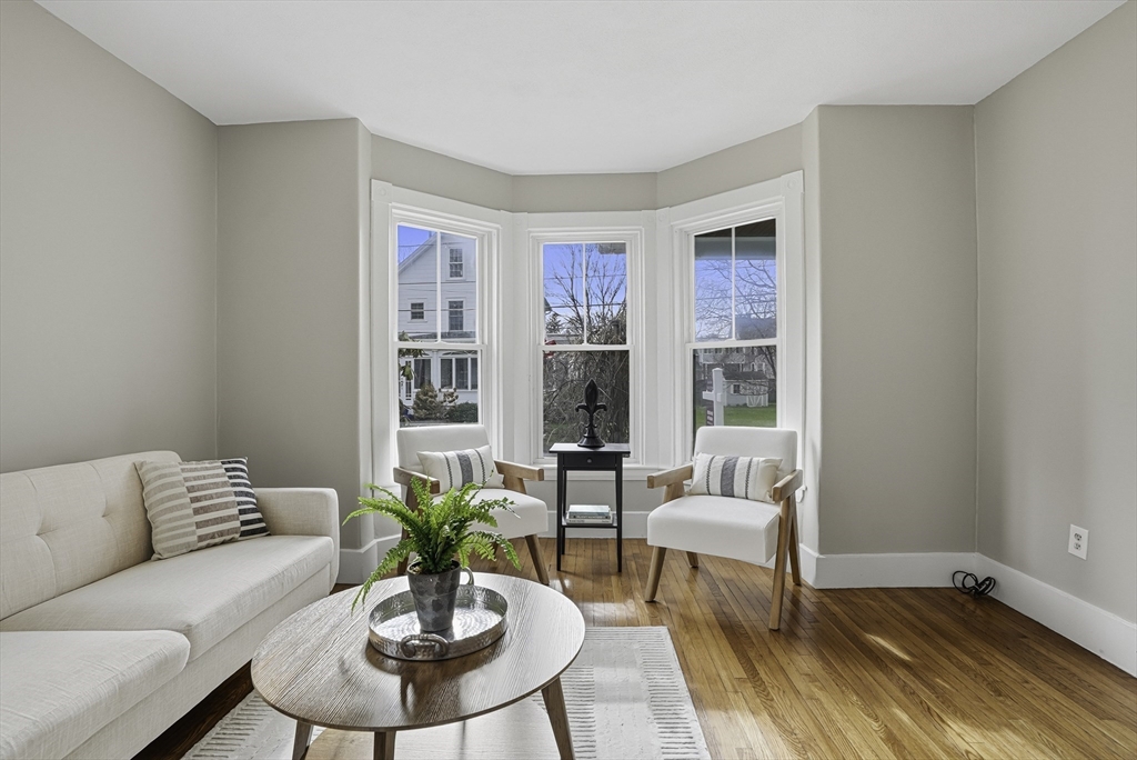 2 Maple Avenue Natick, MA 01760 - Photo 8 of 41 a living room with furniture and a potted plant