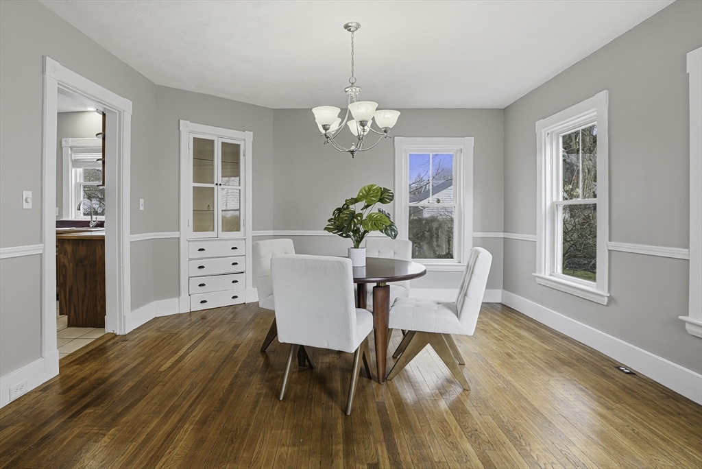 2 Maple Avenue Natick, MA 01760 - Photo 10 of 41 a dining room with furniture a chandelier and wooden floor