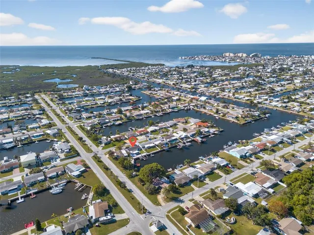 an aerial view of city and lake