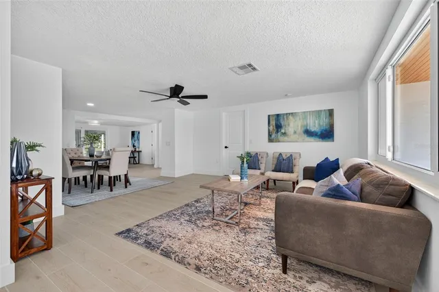 a living room with furniture and a table