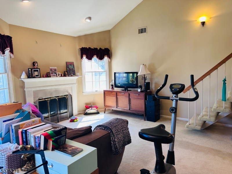 70 Boulder Run Road Paterson, NJ 07501 - Photo 17 of 29 a living room with furniture and a fireplace