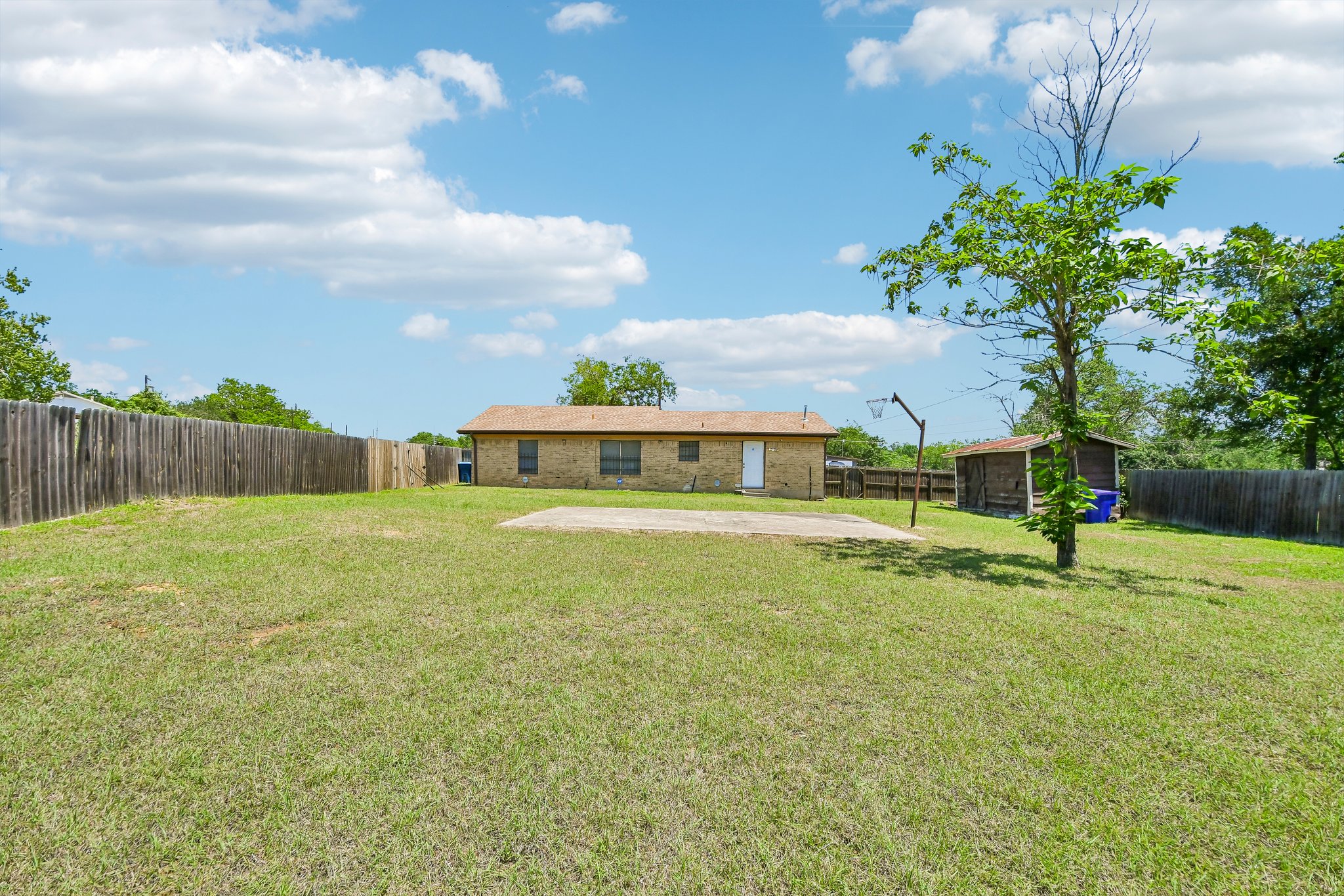 101 Brown Street Elgin, TX 78621 - Photo 30 of 32 a front view of house with yard and green space