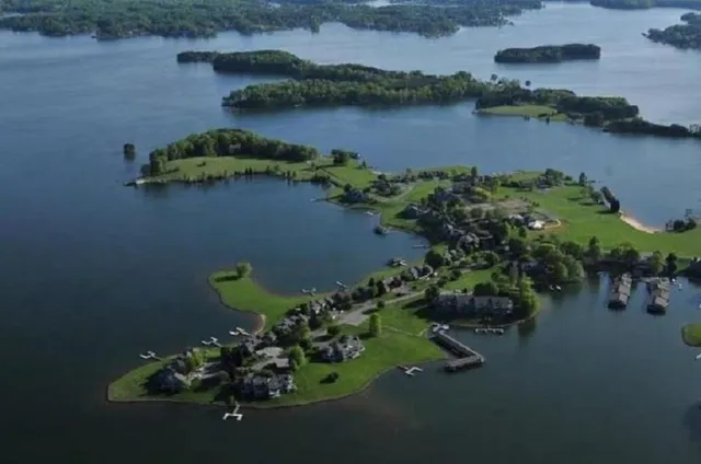 an aerial view of a house with a lake view