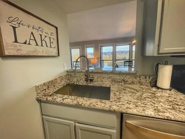 a kitchen with a stove and a sink