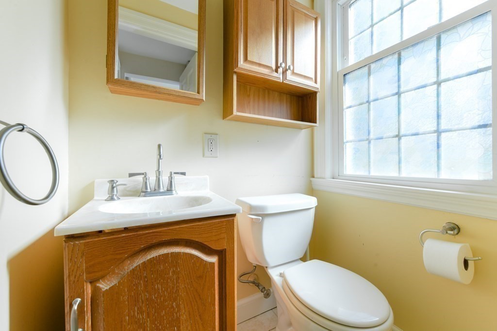 47 White Pine Road Newton, MA 02464 - Photo 12 of 24 a bathroom with a toilet sink and mirror
