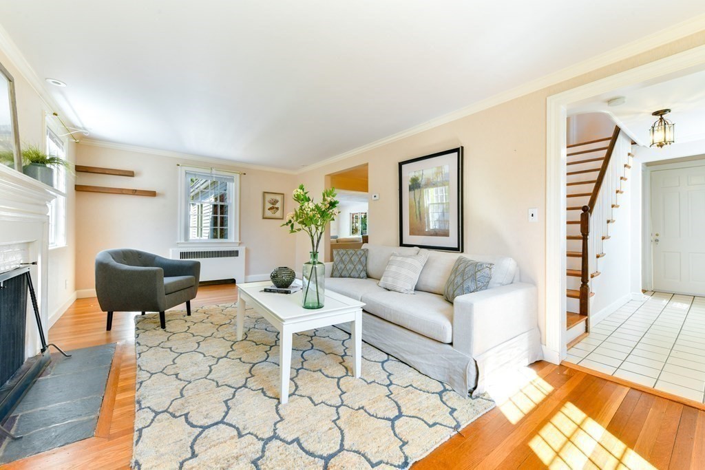 47 White Pine Road Newton, MA 02464 - Photo 2 of 24 a living room with furniture a fireplace and a table