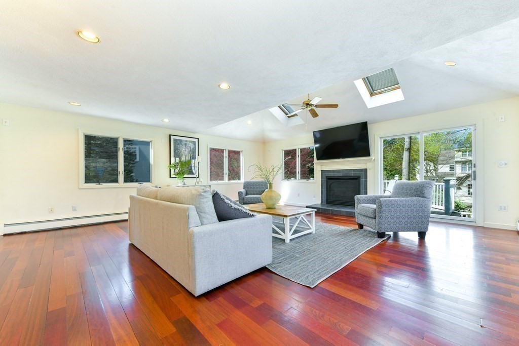 47 White Pine Road Newton, MA 02464 - Photo 8 of 24 a living room with furniture fireplace and a large window