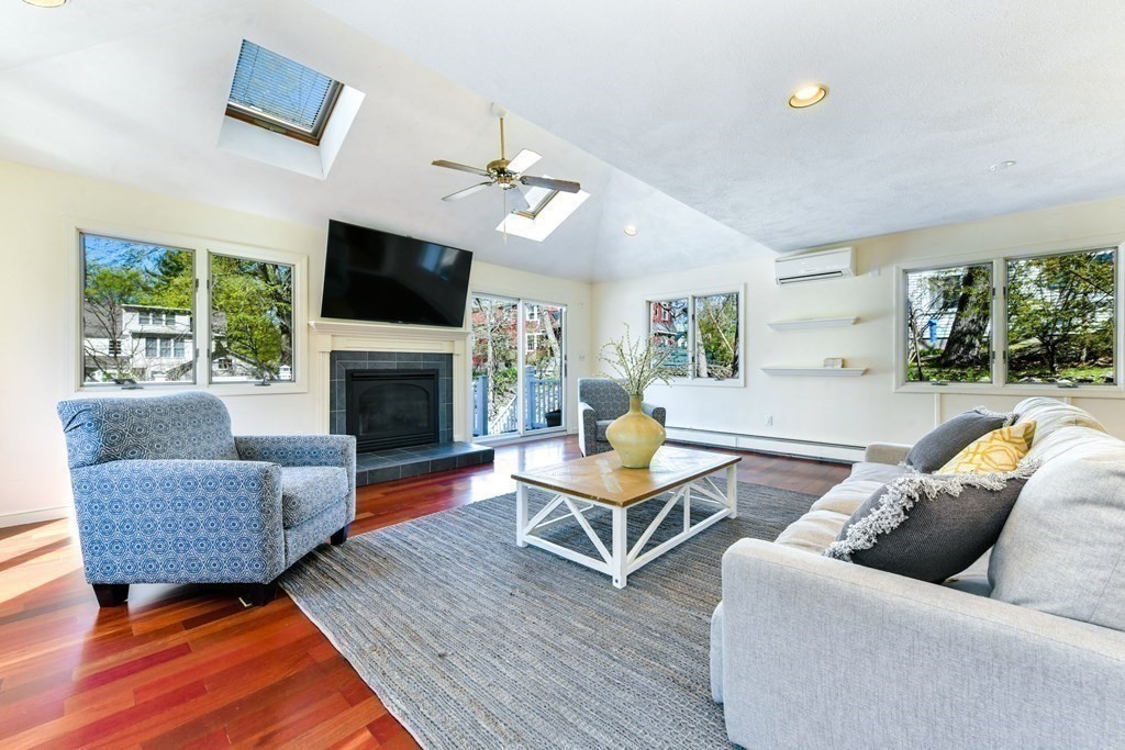 47 White Pine Road Newton, MA 02464 - Photo 10 of 24 a living room with furniture fireplace and flat screen tv