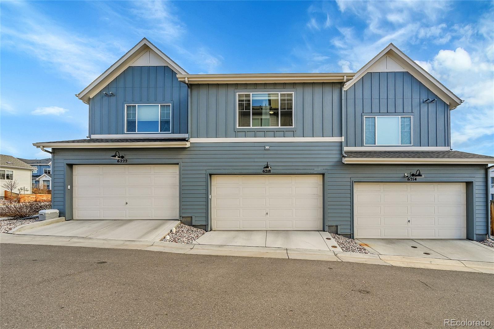 6218 West 28th Avenue Wheat Ridge, CO 80214 - Photo 16 of 16 a front view of a house with a yard and garage