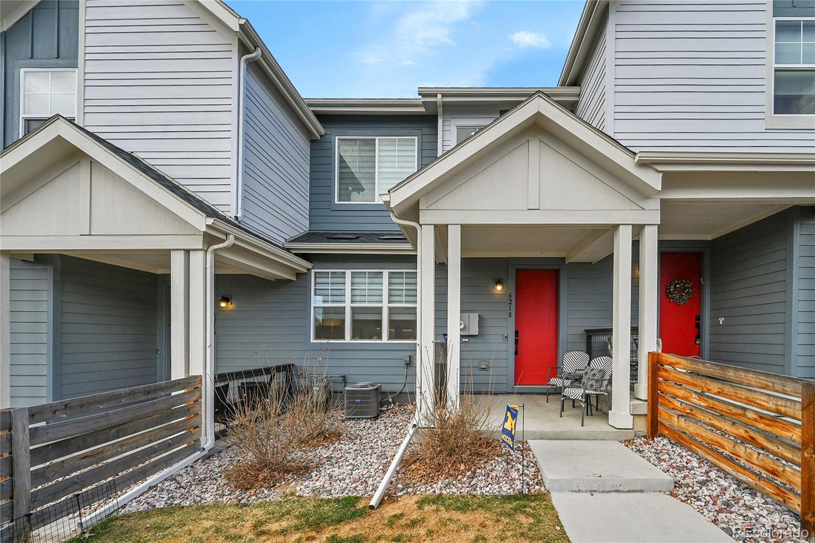 6218 West 28th Avenue Wheat Ridge, CO 80214 - Photo 2 of 16 a view of small house with large windows and wooden fence