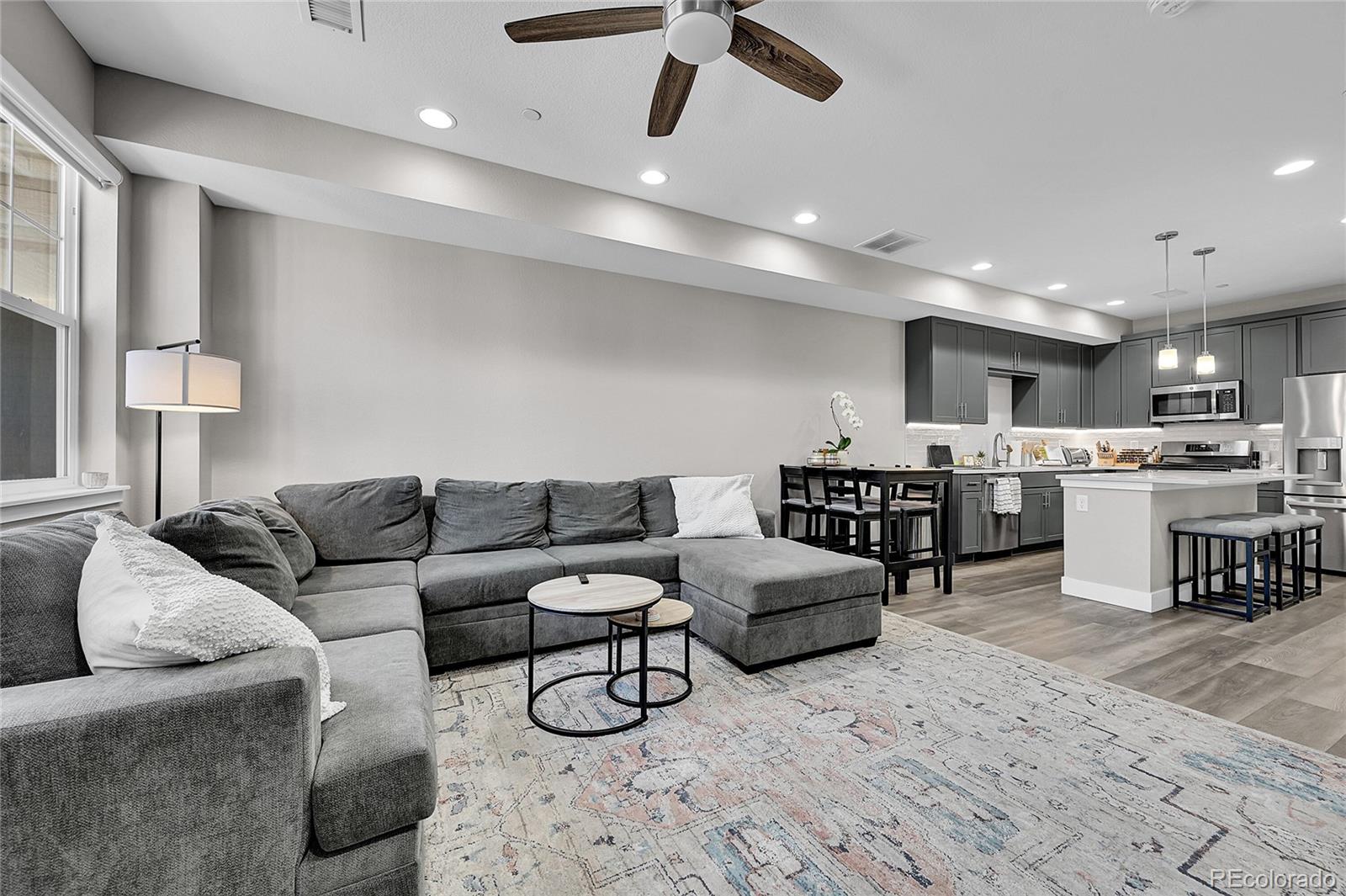 6218 West 28th Avenue Wheat Ridge, CO 80214 - Photo 3 of 16 a living room with furniture and kitchen view