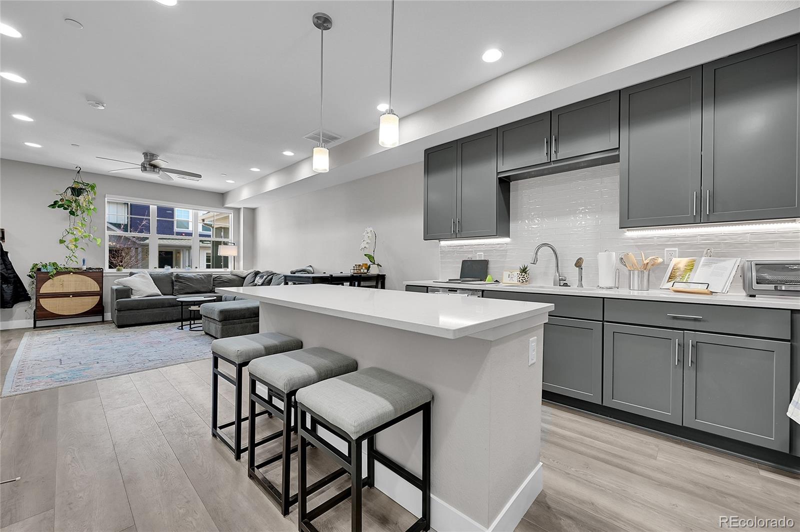 6218 West 28th Avenue Wheat Ridge, CO 80214 - Photo 8 of 16 a kitchen with counter space cabinets a sink and appliances