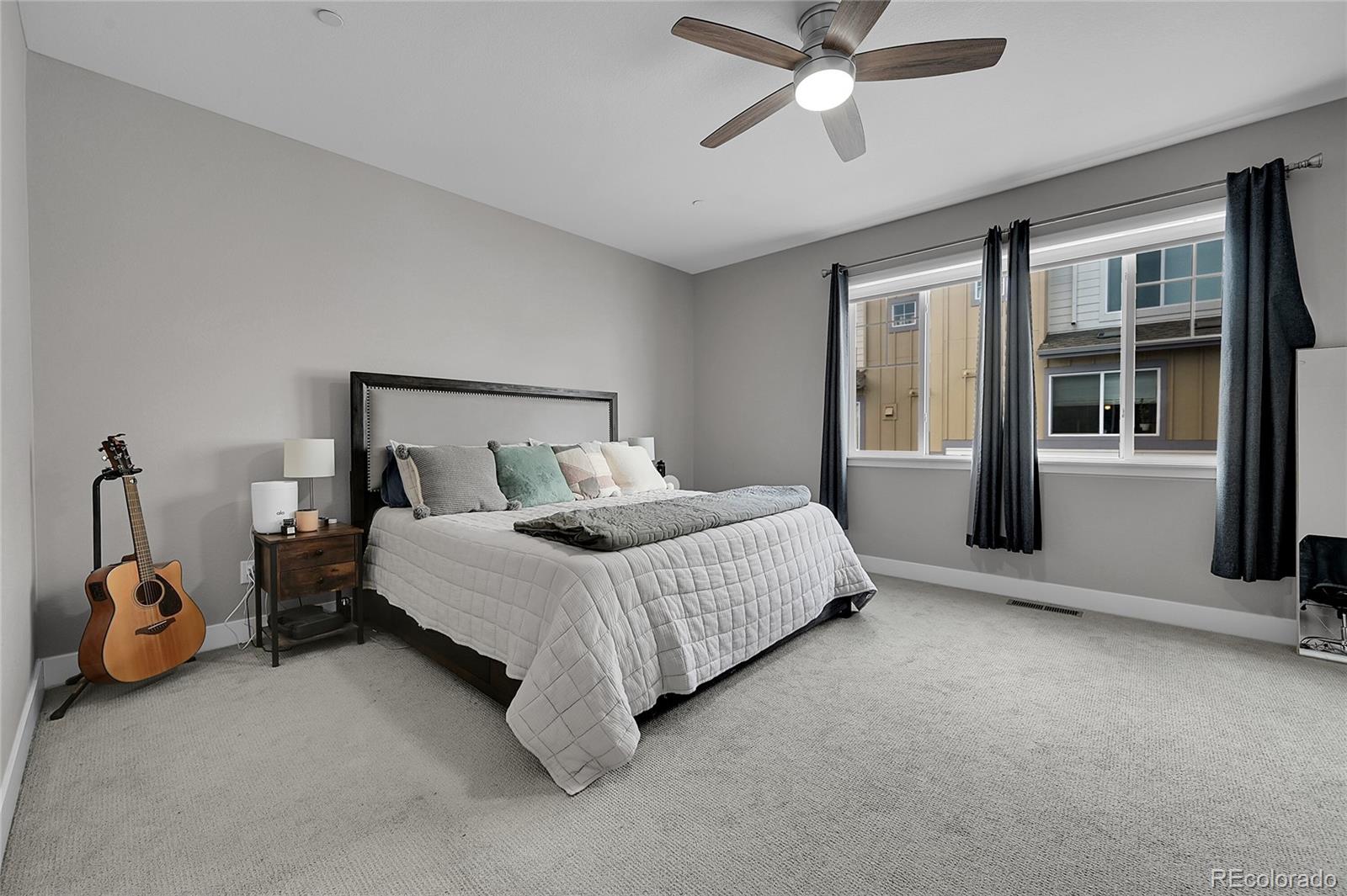 6218 West 28th Avenue Wheat Ridge, CO 80214 - Photo 10 of 16 a bedroom with a bed and a window